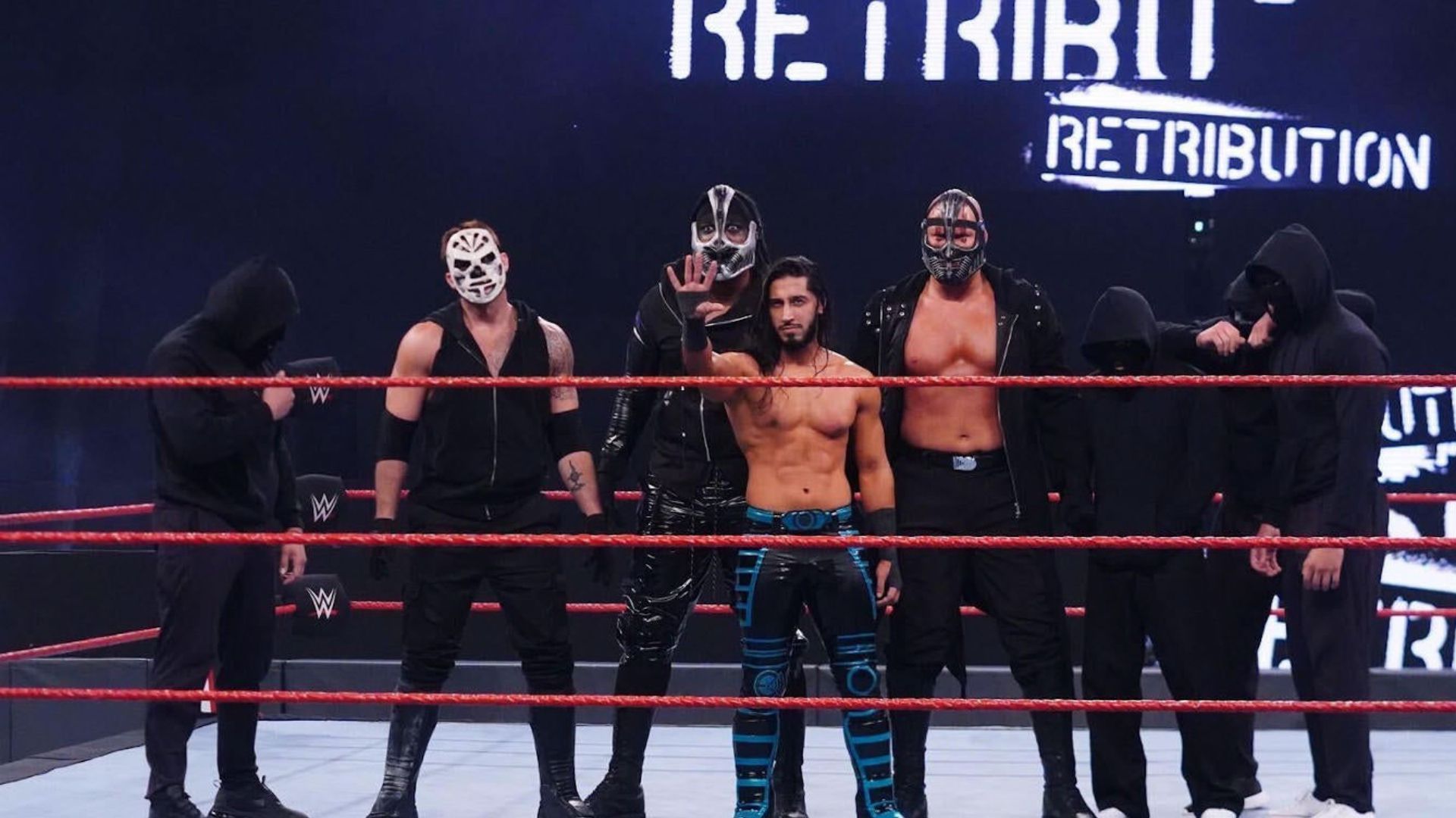 RETRIBUTION poses in the ring during WWE RAW