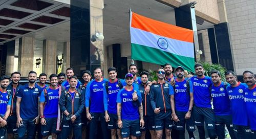 KL Rahul and Co in front of Tricolor. [Pic credits: BCCI]