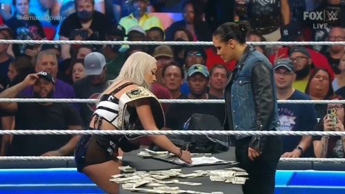 Liv Morgan & Shayna Baszler signed the contract for their title match next month