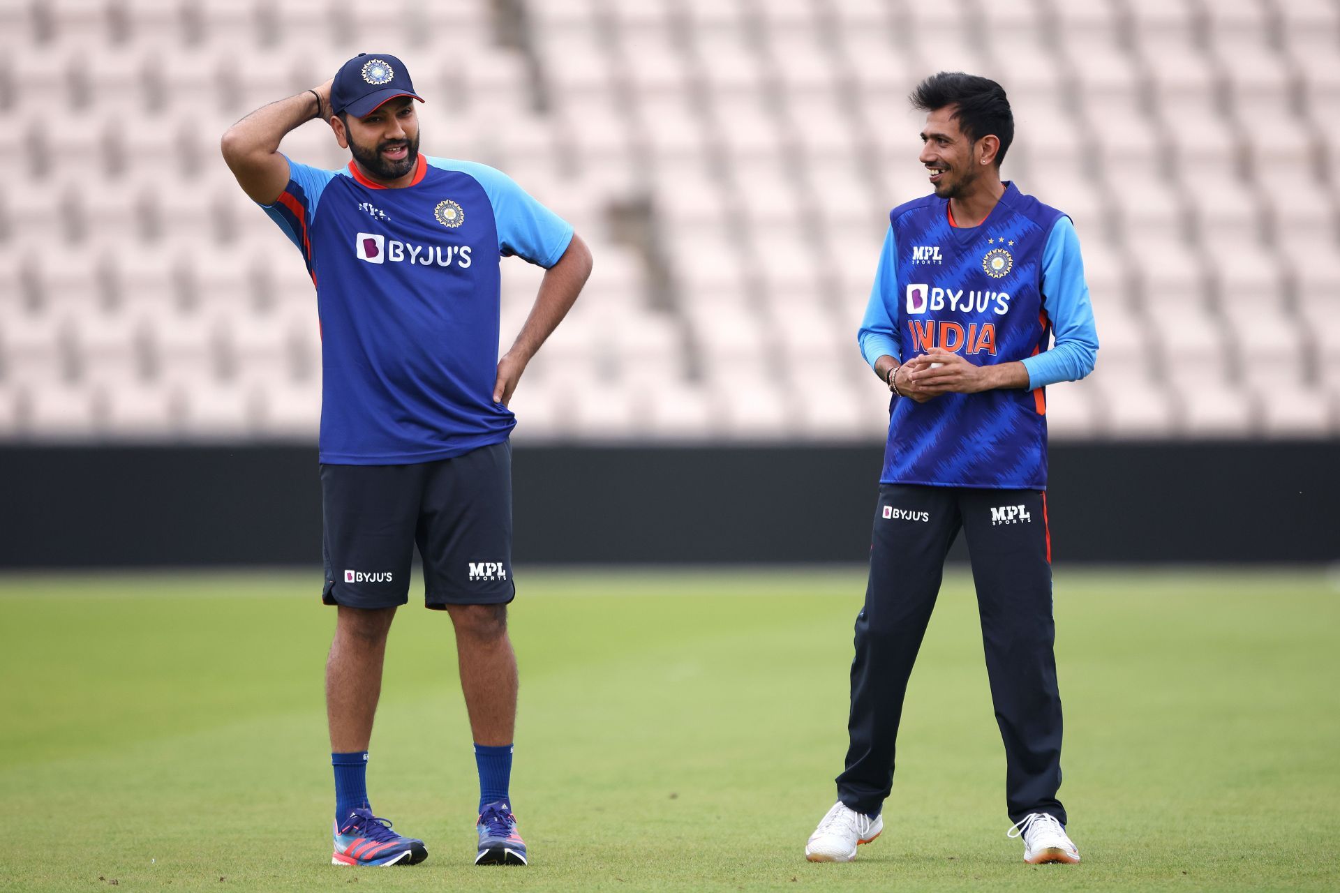 Yuzvendra Chahal (right) chats with captain Rohit Sharma. Pic: Getty Images