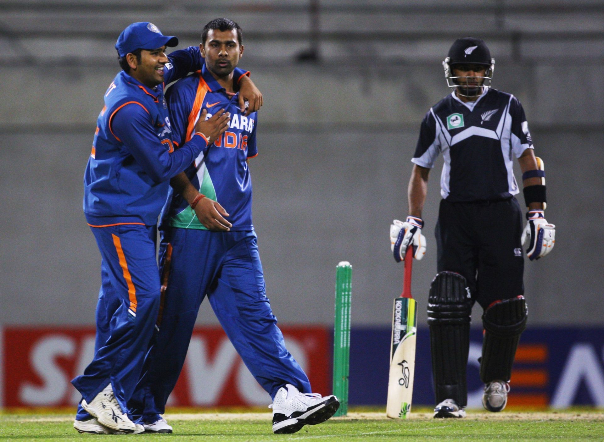 Rohit Sharma (left) and Praveen Kumar. Pic: Getty Images