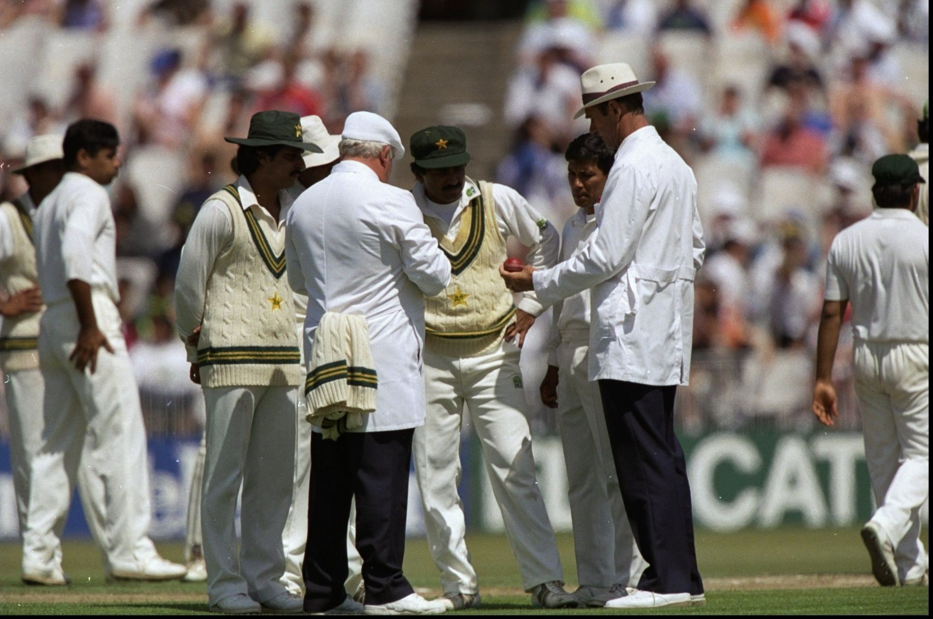 The umpires and the Pakistan team discuss the condition of the ball during the third Test against England at Old Trafford in 1992. Pic: Getty Images