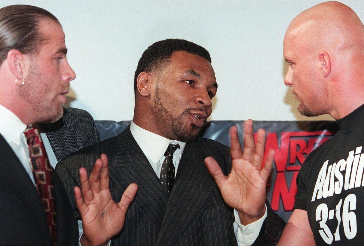 &quot;Iron&quot; Mike Tyson stood in the middle between Shawn Michaels &amp; &quot;Stone Cold&quot; Steve Austin during the WrestleMania XIV press conference.