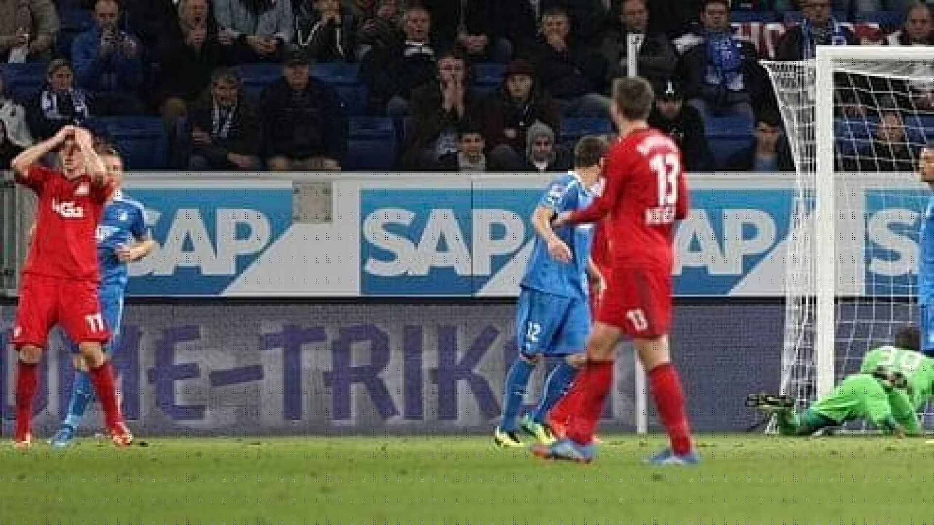 Stefan Kiessling of Bayer Leverkusen, on the left, enjoys his customary celebration after scoring against Hoffenheim. Daniel Roland/AFP/Getty Images provided the image.