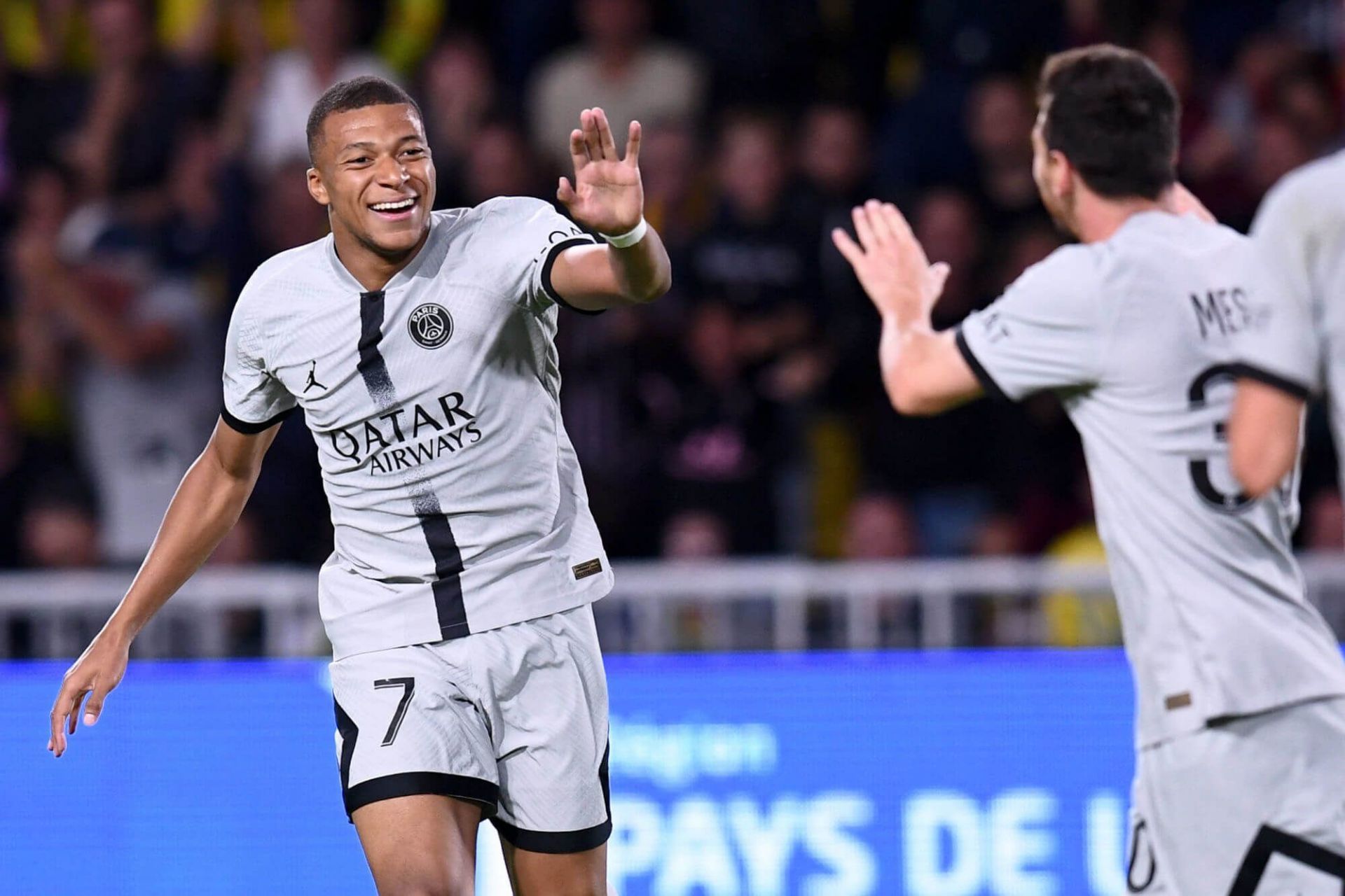 Kylian Mbappe and Lionel Messi celebrating their side