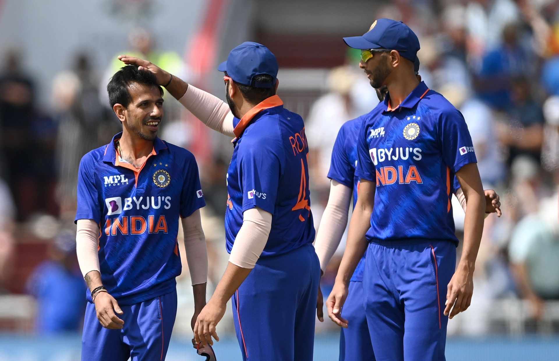 Yuzvendra Chahal (left) celebrates a wicket with teammates. Pic: Getty Images