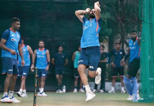 The former India captain bowls in the nets.