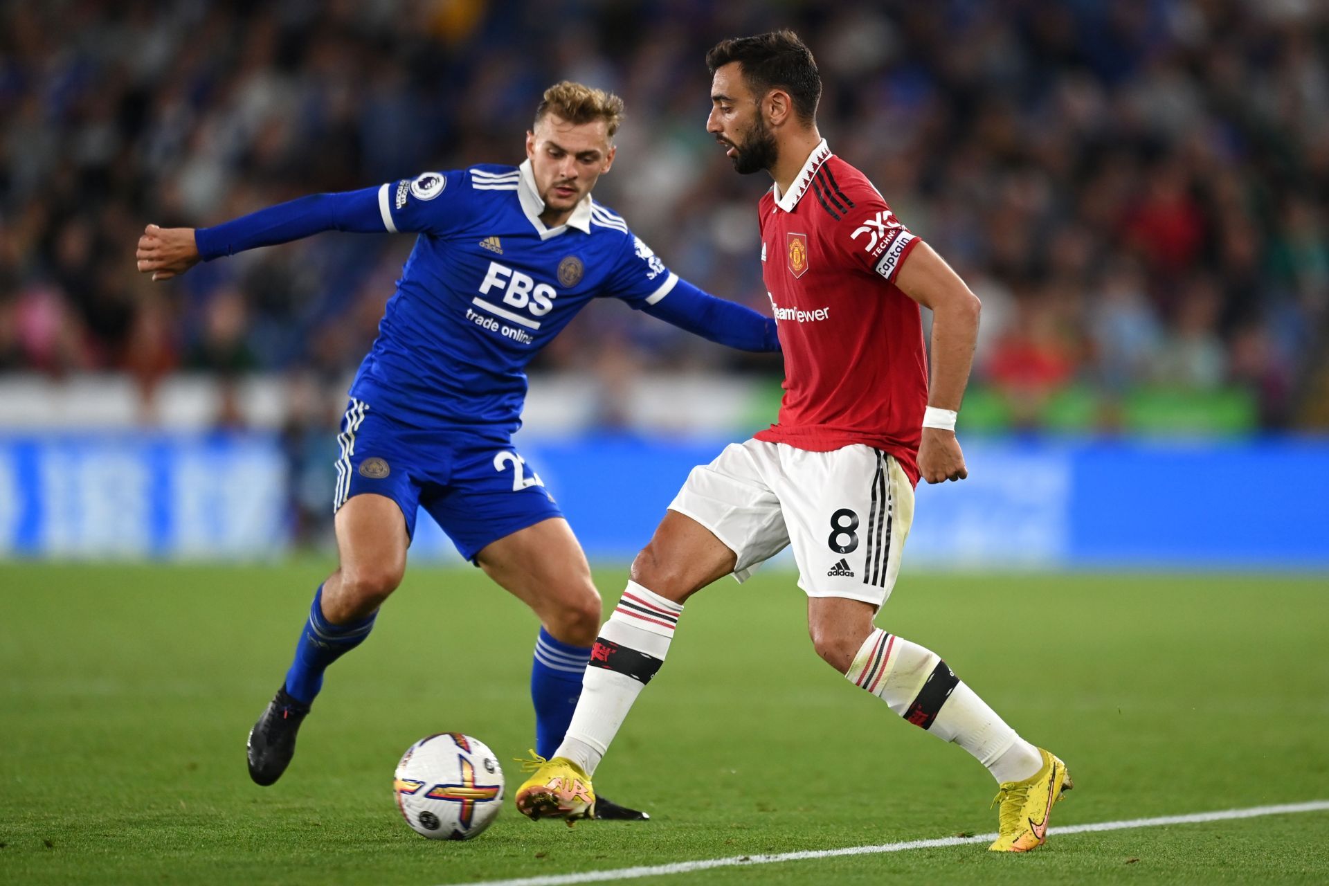 Bruno Fernandes (R) in action for United