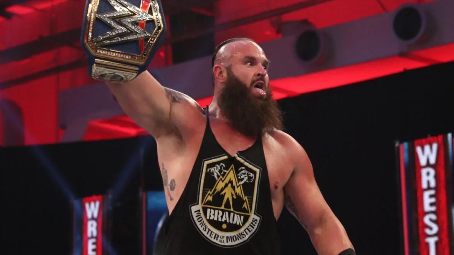 Braun Strowman holding up the WWE Universal Title at WrestleMania 36 (2020)