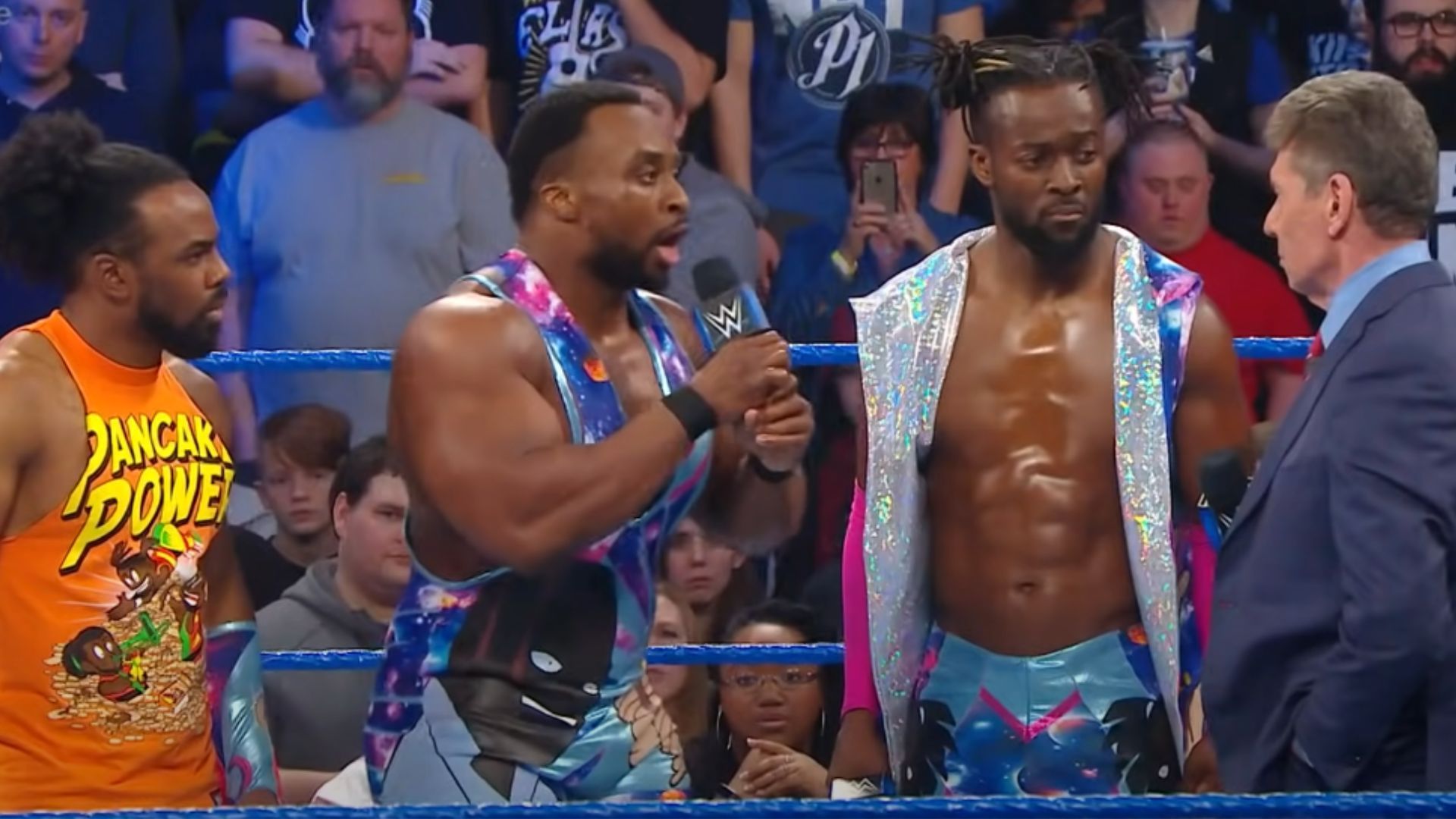 Left to right: Xavier Woods, Big E, Kofi Kingston, and Vince McMahon