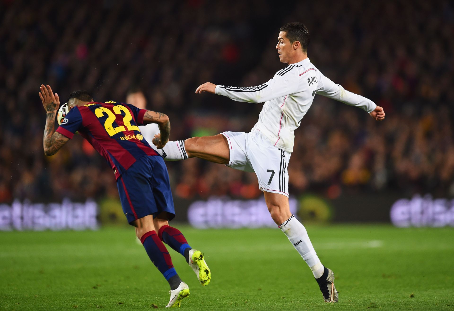 Dani Alves (left) versus Cristiano Ronaldo in El Clasico