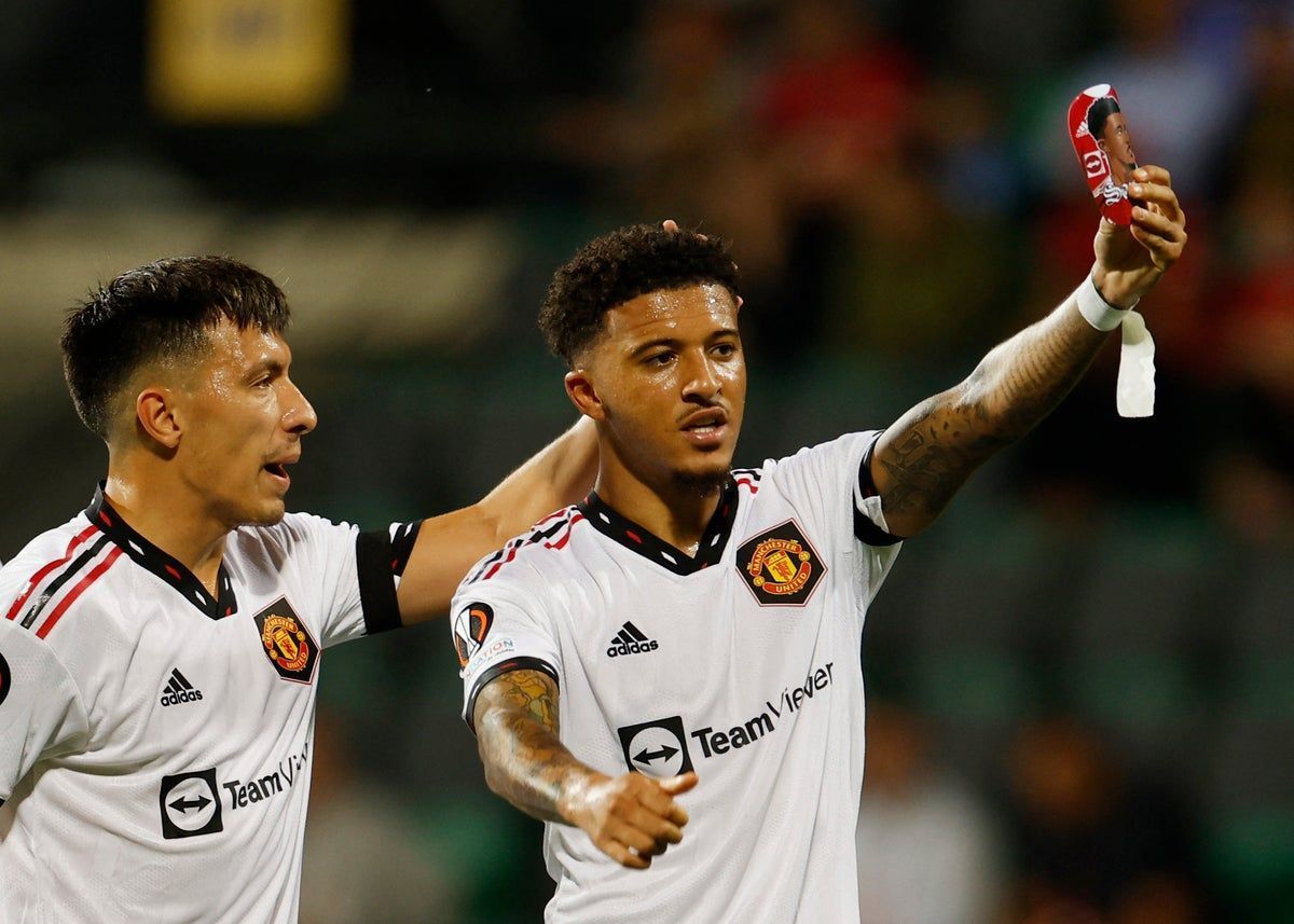 Jadon Sancho and Lisandro Martinez celebrate their side