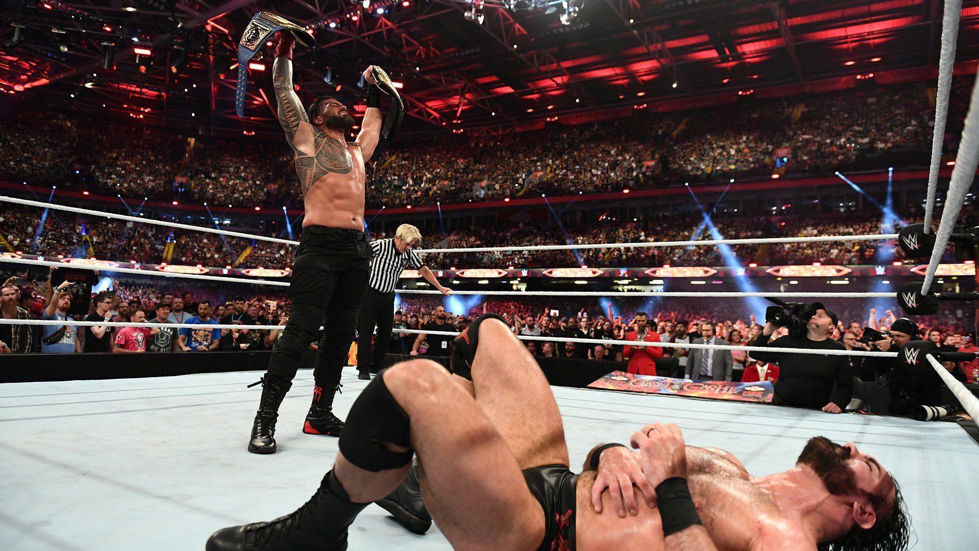 Roman Reigns standing tall in victory