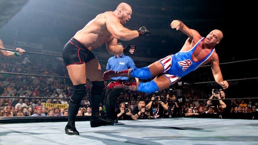 Nathan Jones takes a dropkick from WWE Hall of Famer Kurt Angle