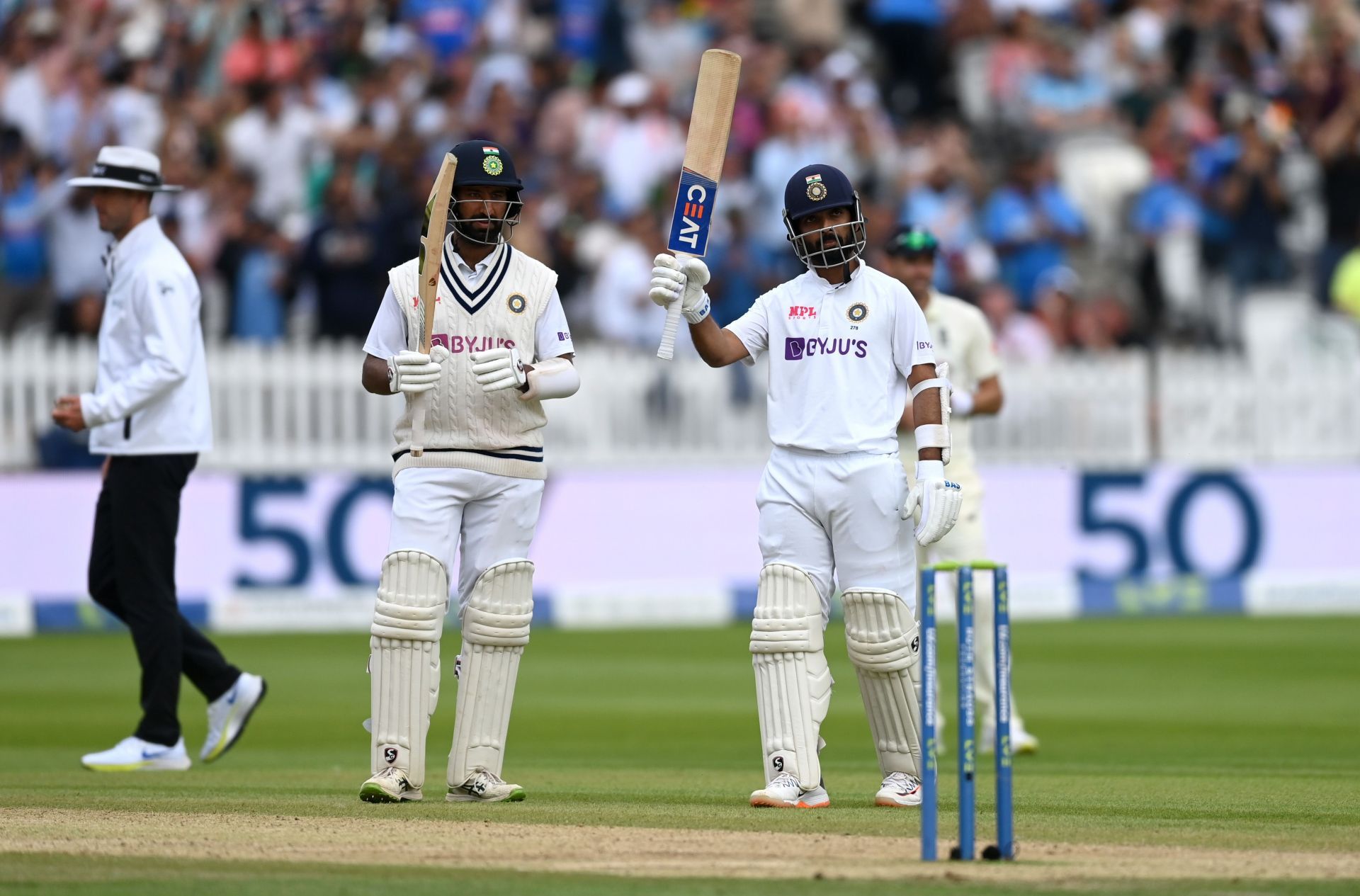 Ajinkya Rahane (right) raises his bat after reaching his half-century during the 2021 Lord’s Test. Pic: Getty Images