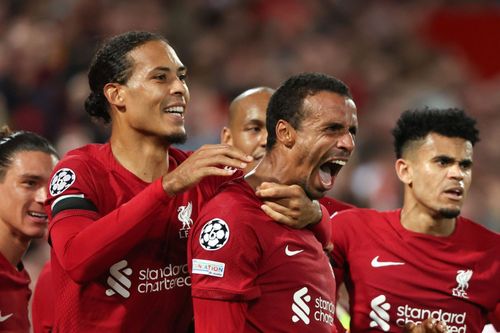 Joel Matip celebrates after scoring the winner