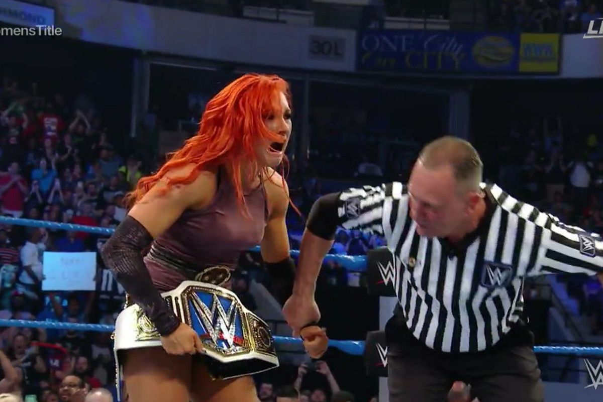 Becky Lynch in 2016 as the SmackDown Women's Champion. Her reign was cut short due to WWE management having an issue with her accent.