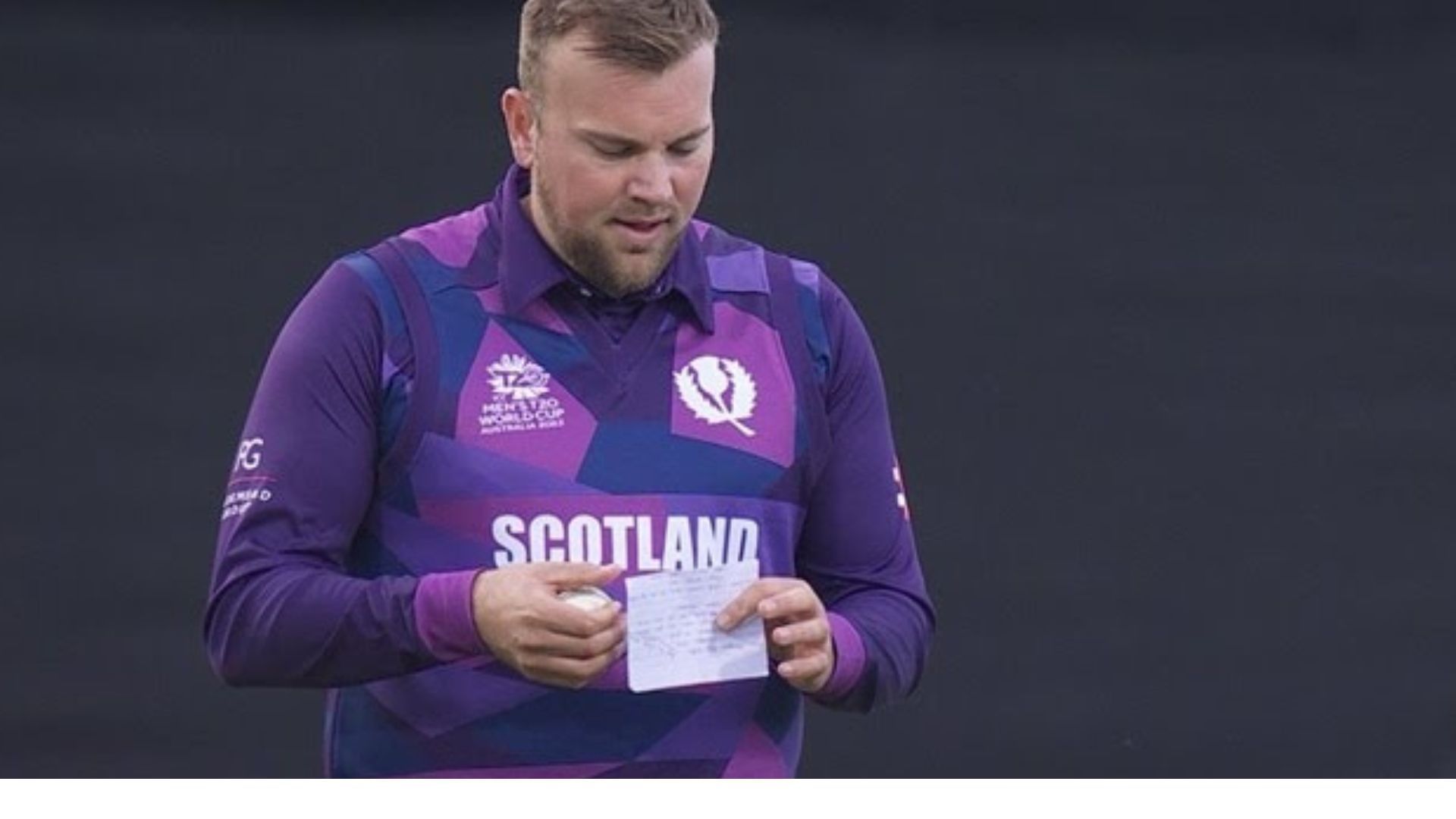 Mark Watt was seen carrying a piece of paper during the SCO-WI game