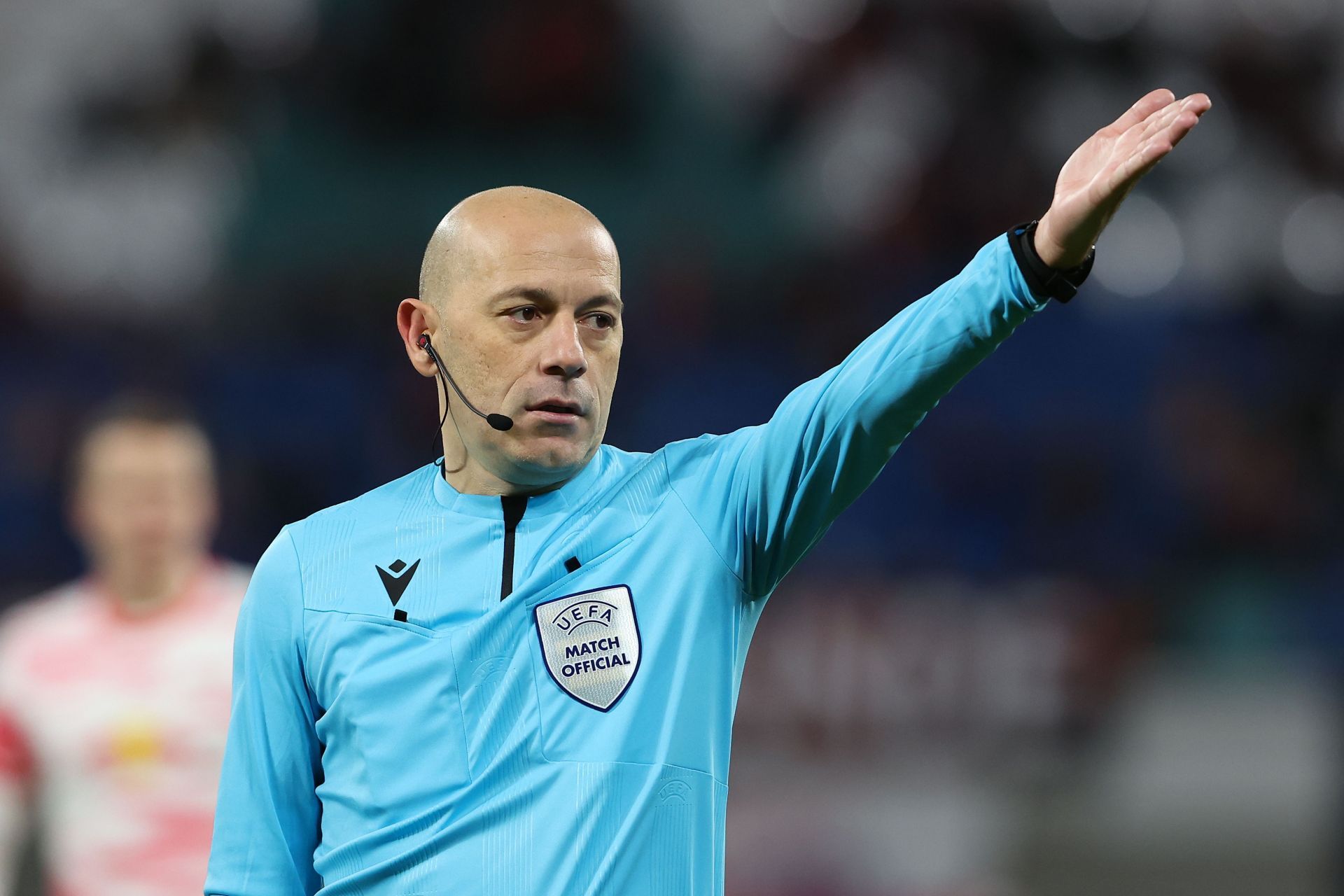 Referee Cüneyt Cakir reacts during the UEFA Europa League Knockout Round Play-Offs Leg One match between RB Leipzig and Real Sociedad.