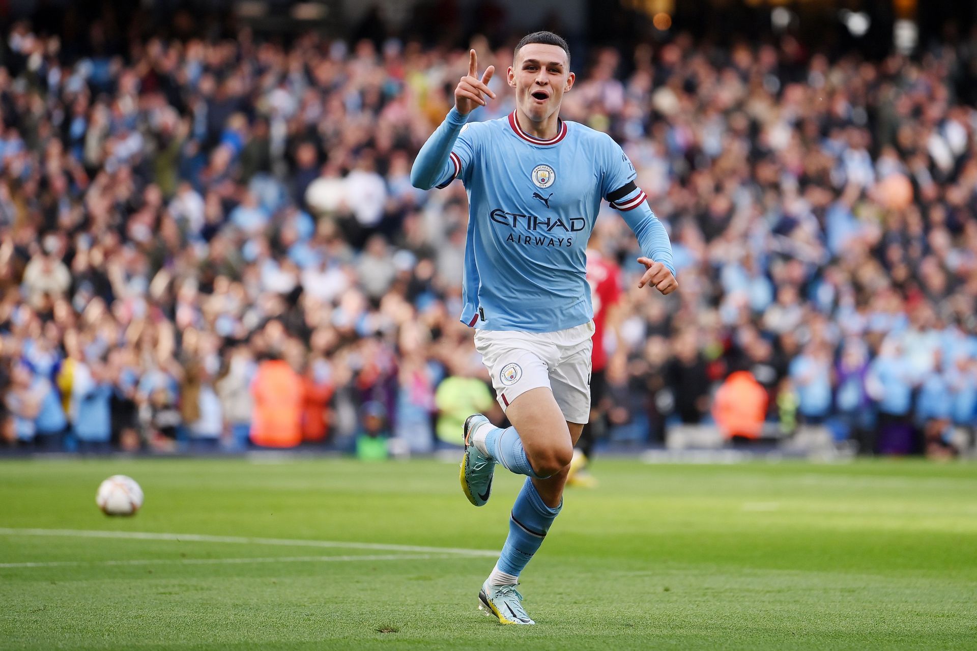 Manchester City's Phil Foden celebrates scoring against Manchester United