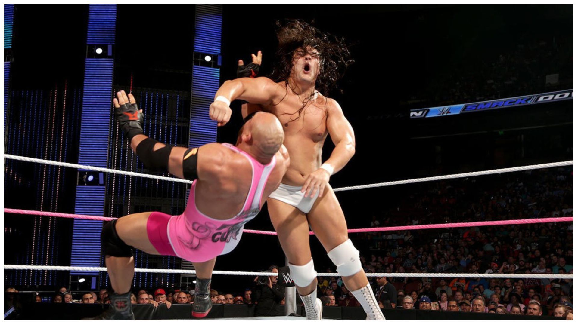 Bo Dallas feeding Ryback with a clothesline