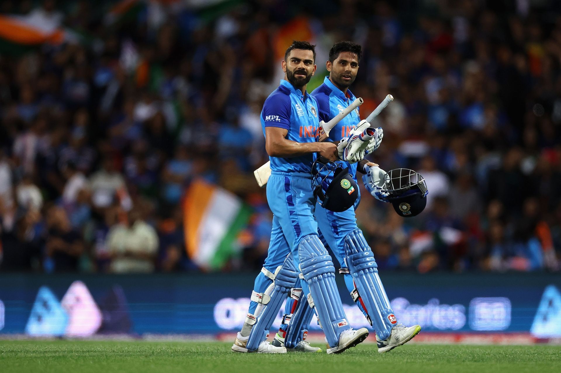 Virat Kohli (L) and Suryakuma Yadav (R) walk off to a rousing reception from the SCG crowd