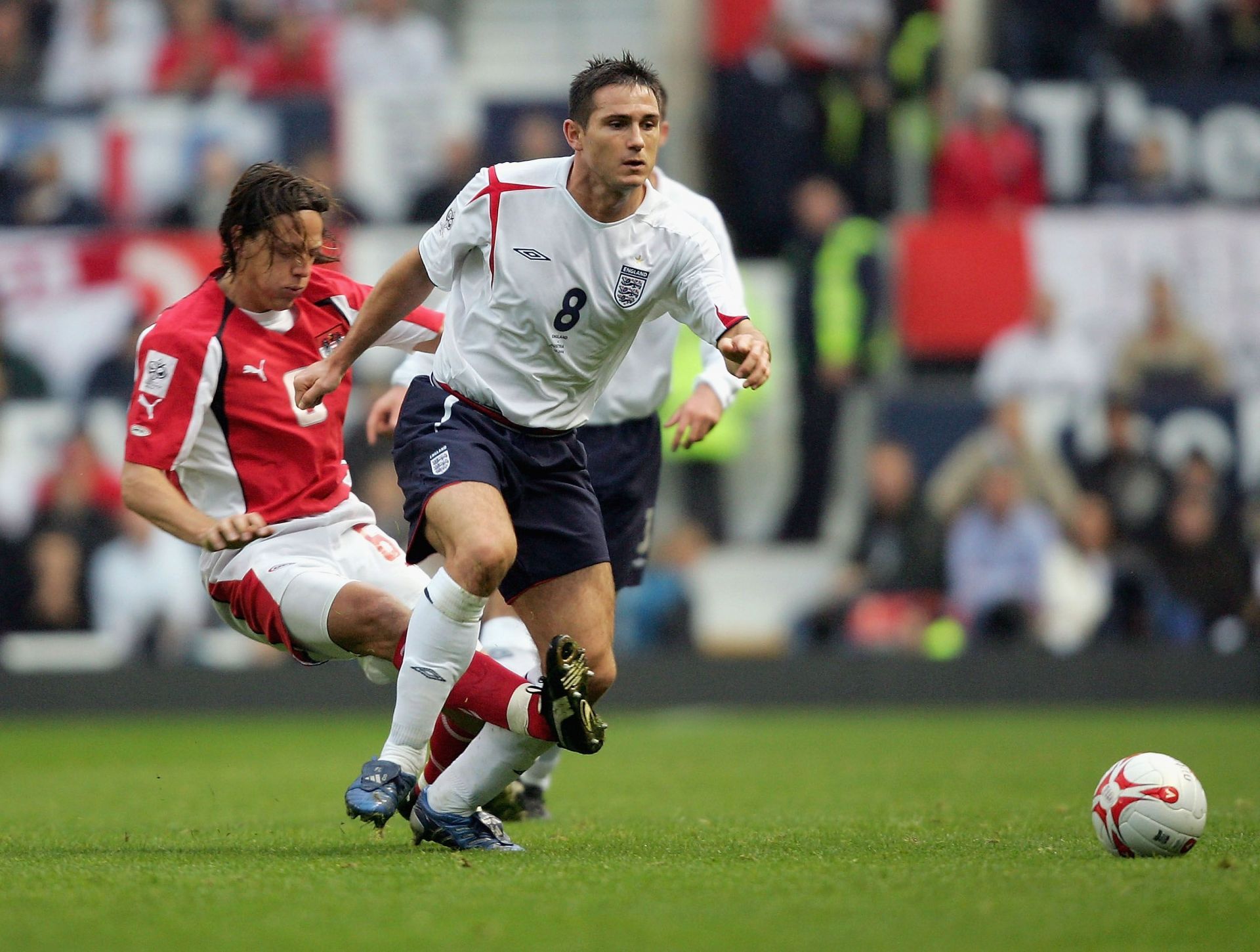 Rene Aufhauser challenges Frank Lampard in a FIFA World Cup qualifier