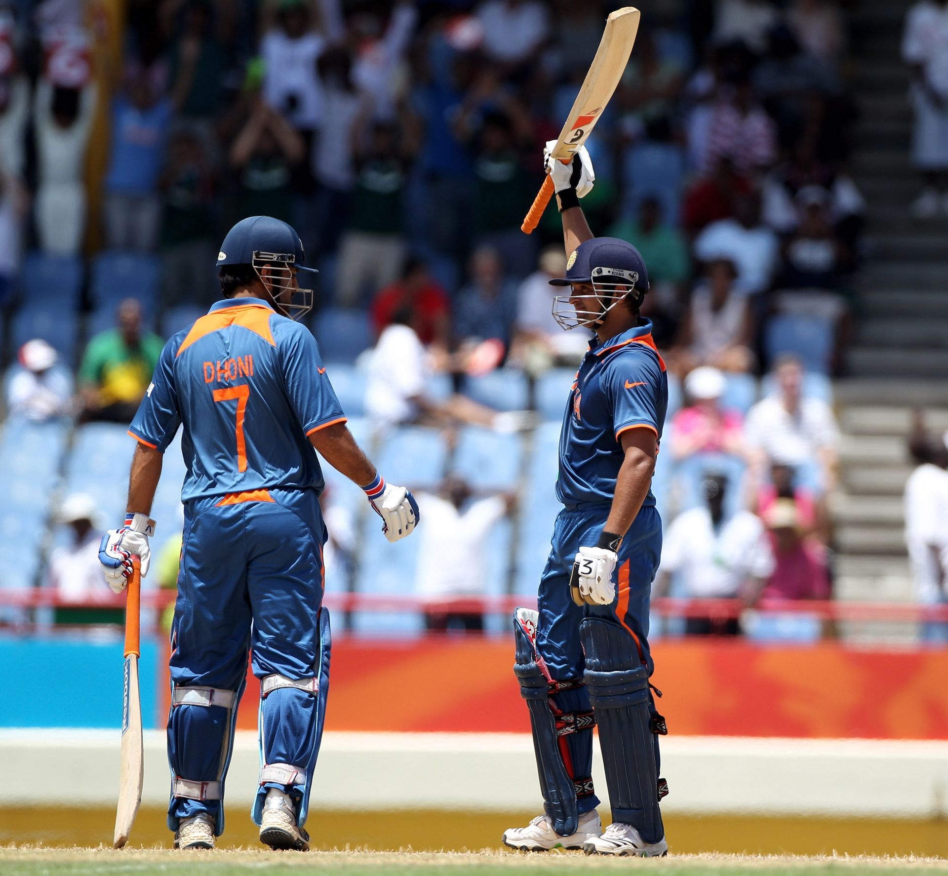 M S Dhoni congratulates Suresh Raina after the latter’s century against South Africa in the 2010 T20 World Cup game against South Africa. Pic: Getty Images