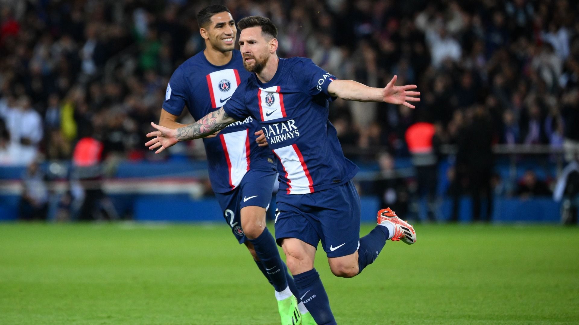 Lionel Messi celebrates his free-kick goal with Achraf Hakimi