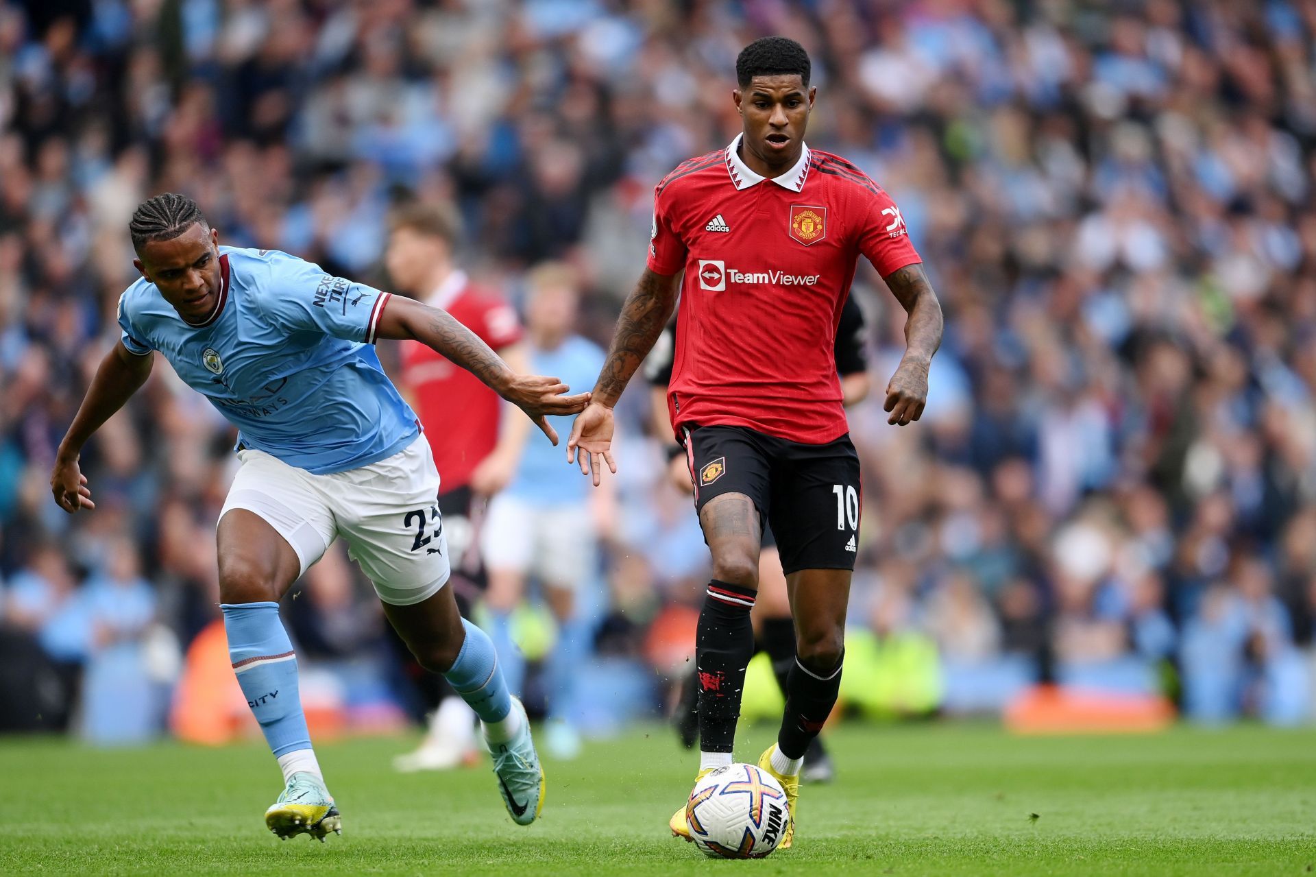 Marcus Rashford (right) of Manchester United has admirers at the Emirates.