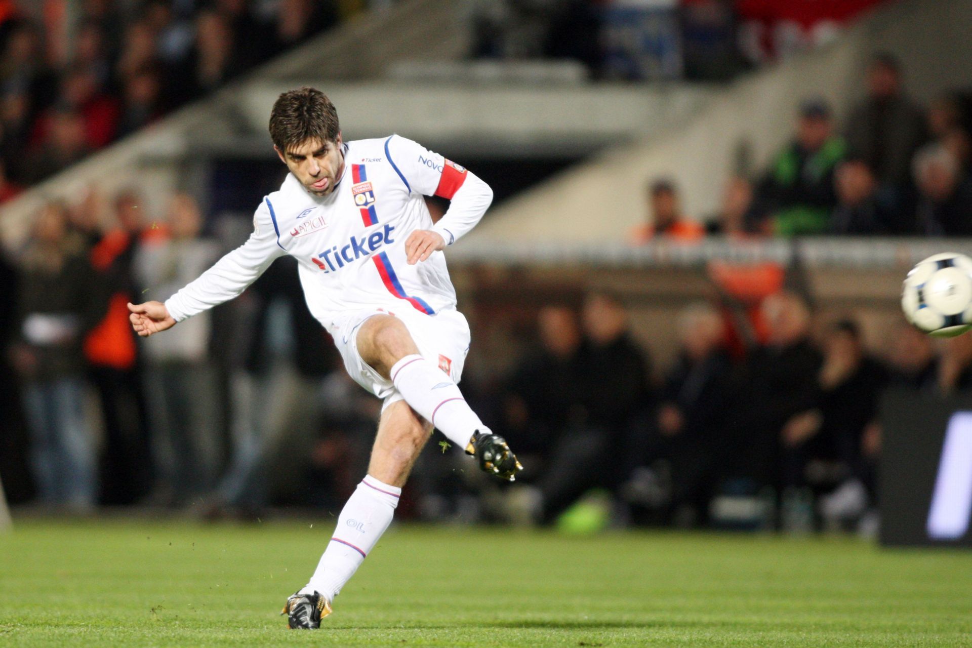 Juninho Pernambucano takes a free-kick for Olympique Lyon