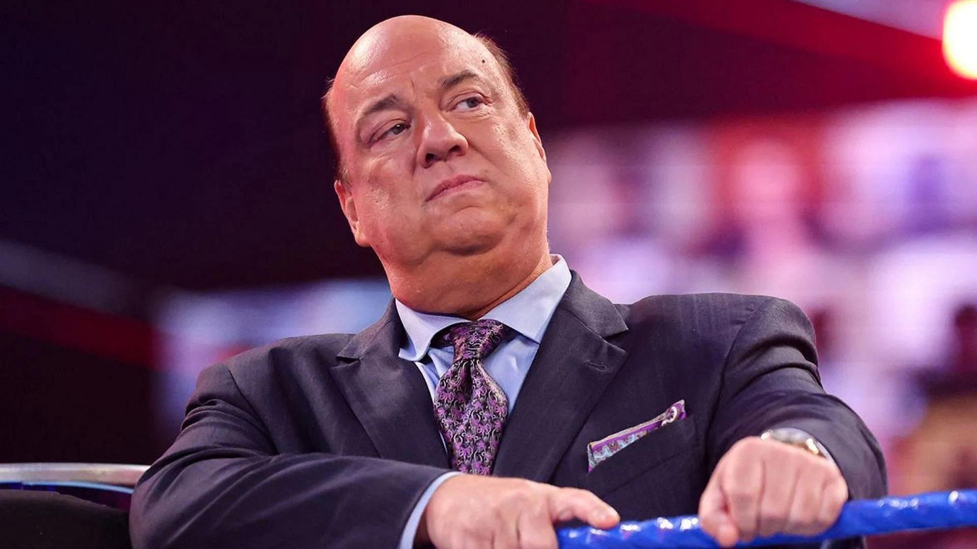 Paul Heyman leaning against the ropes on WWE television. 