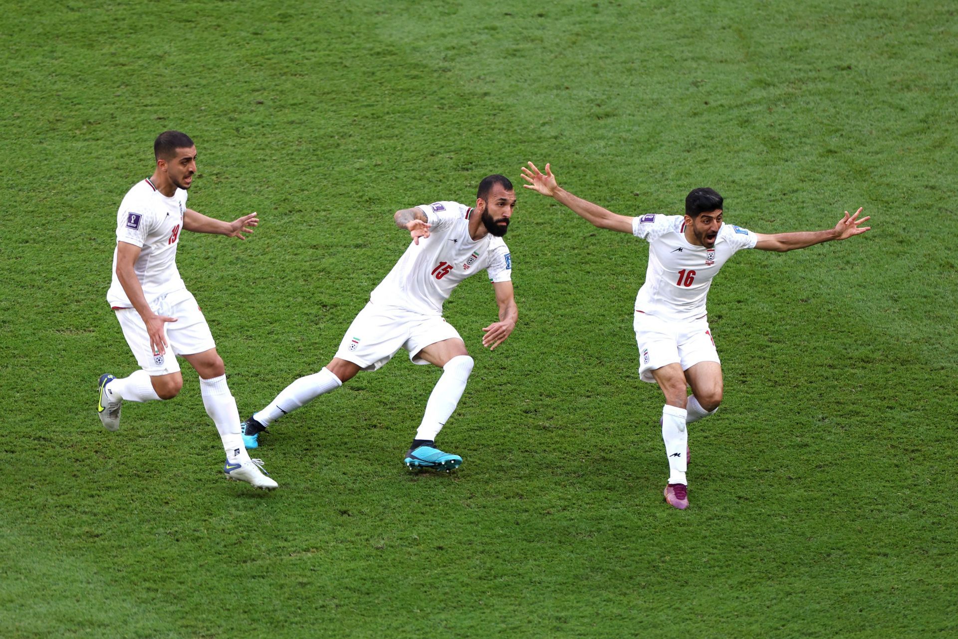 Roozbeh Cheshmi (C) celebrates after giving Iran the lead against Wales.