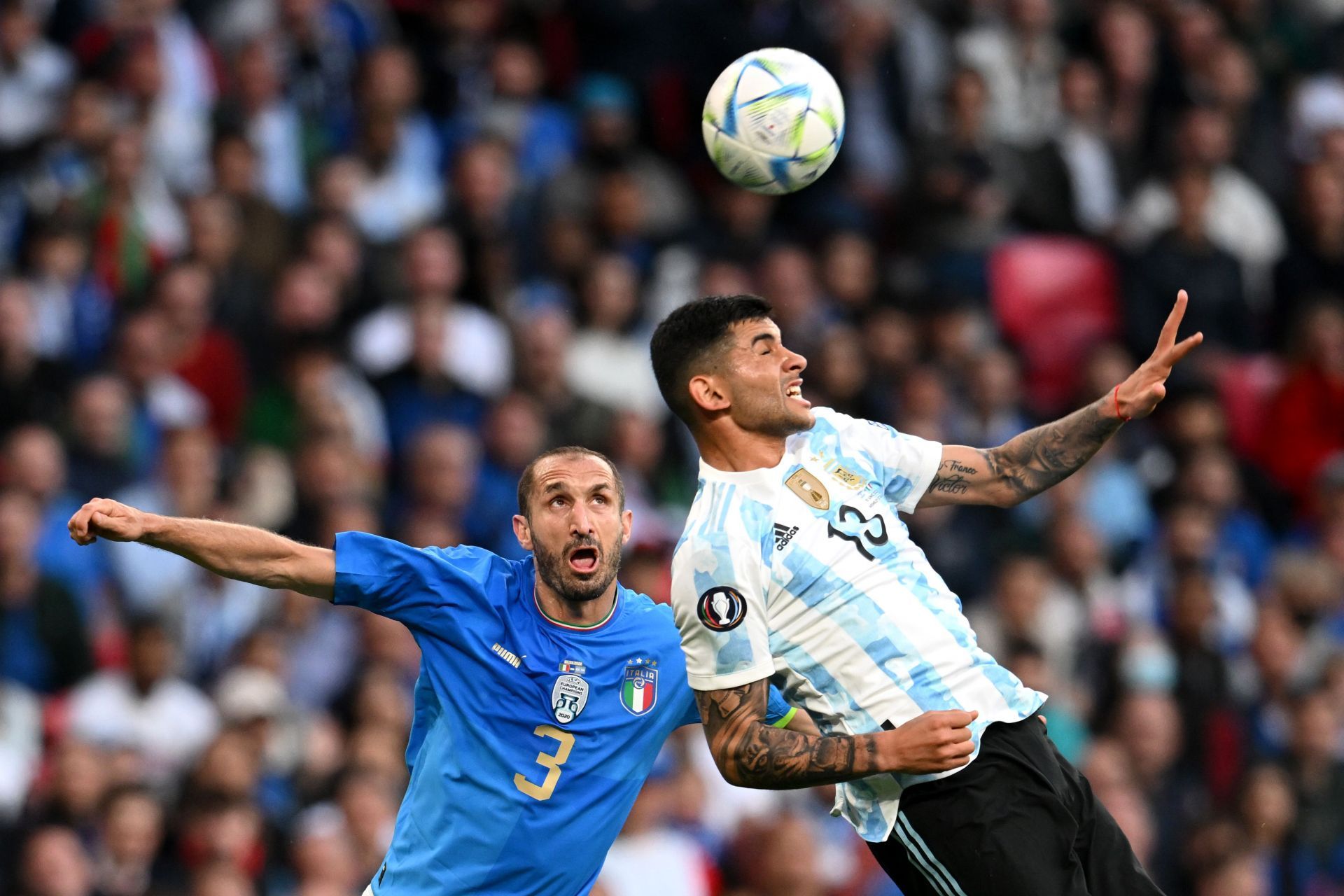 Giorgio Chiellini and Cristian Ronero fight for possession at the Finalissima 2022