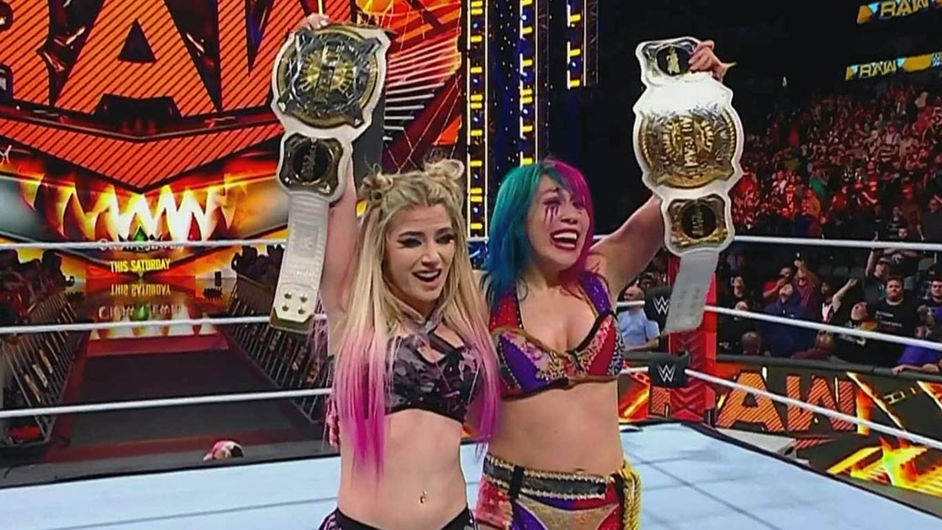 Alexa Bliss &amp; Asuka holding the WWE Women