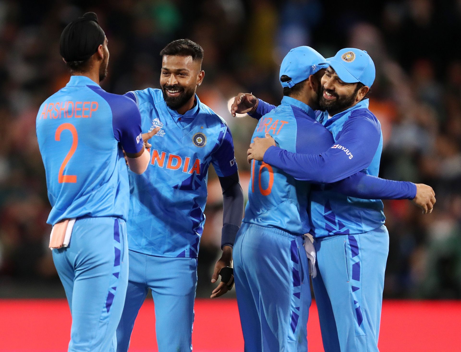 Indian players embrace each other after the 5-run win over Bangladesh