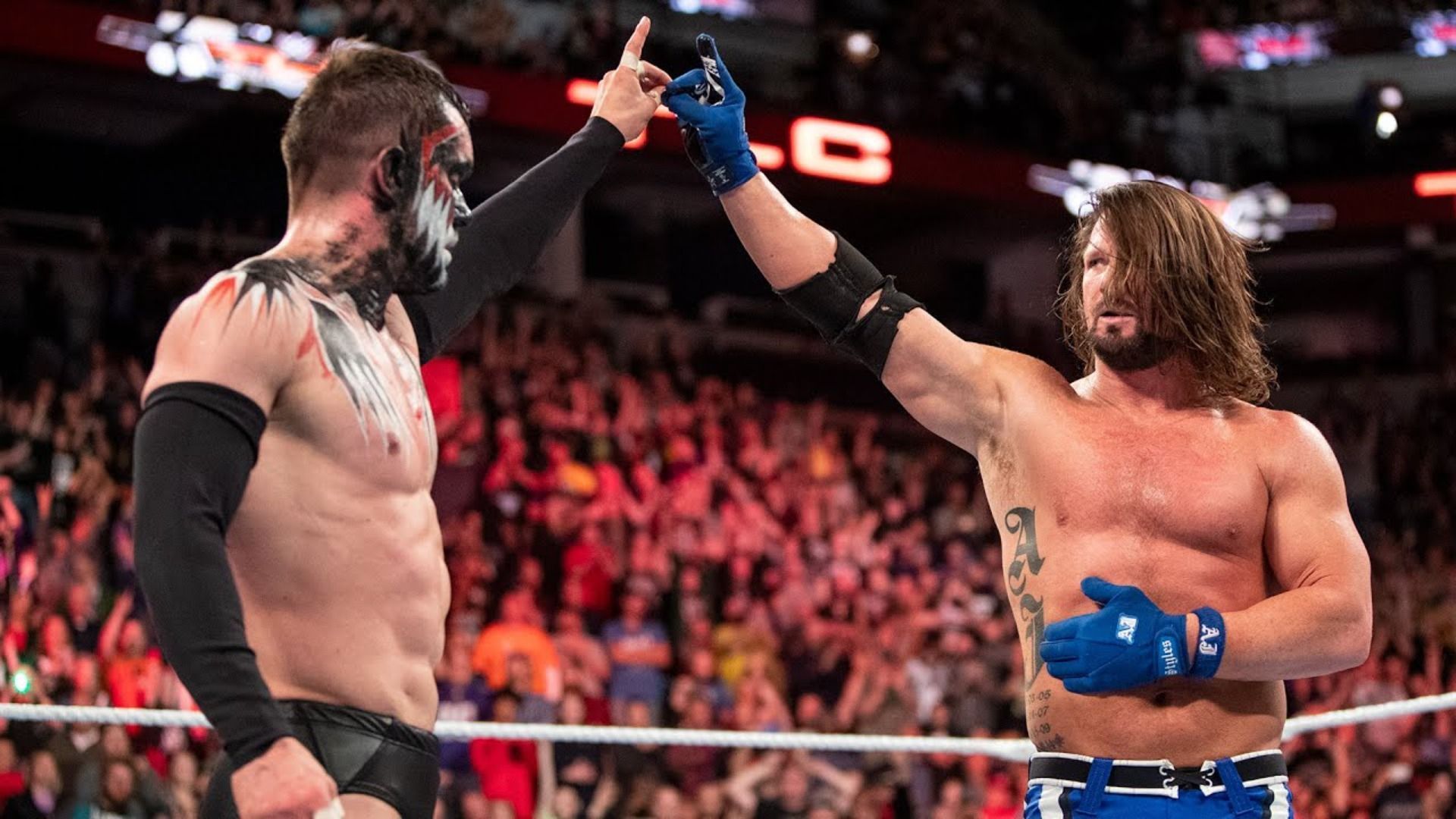 Finn Balor and AJ Styles with the too sweet gesture after their match at TLC 2017.