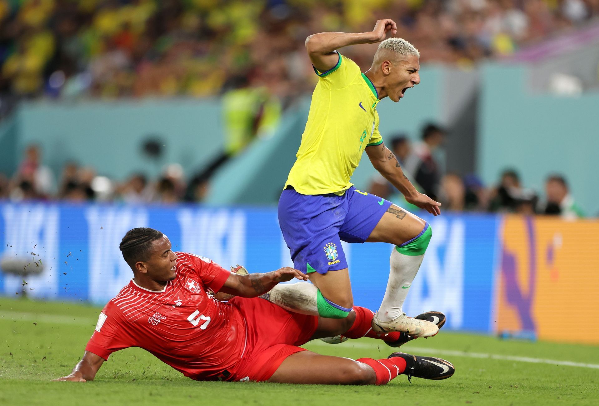 Manuel Akanji tackles Richarlison.