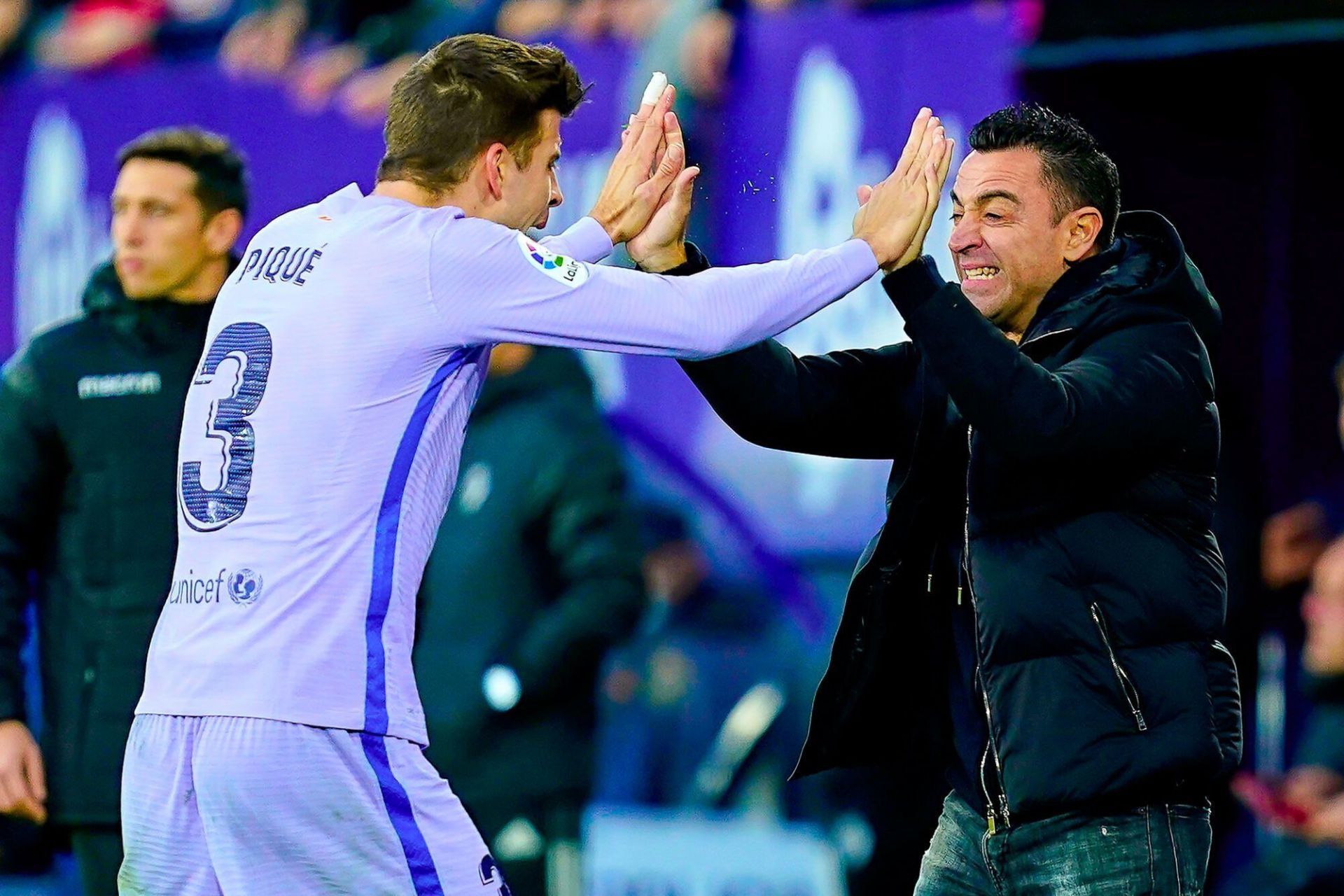 Former teammates Xavi and Gerard Pique