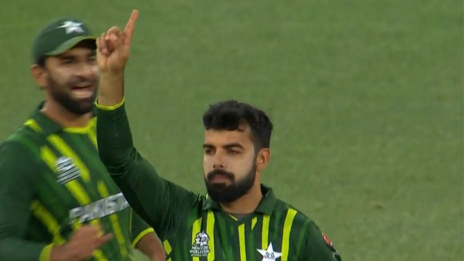 Shadab Khan celebrates after inflicting a direct hit to run out Devon Conway. 