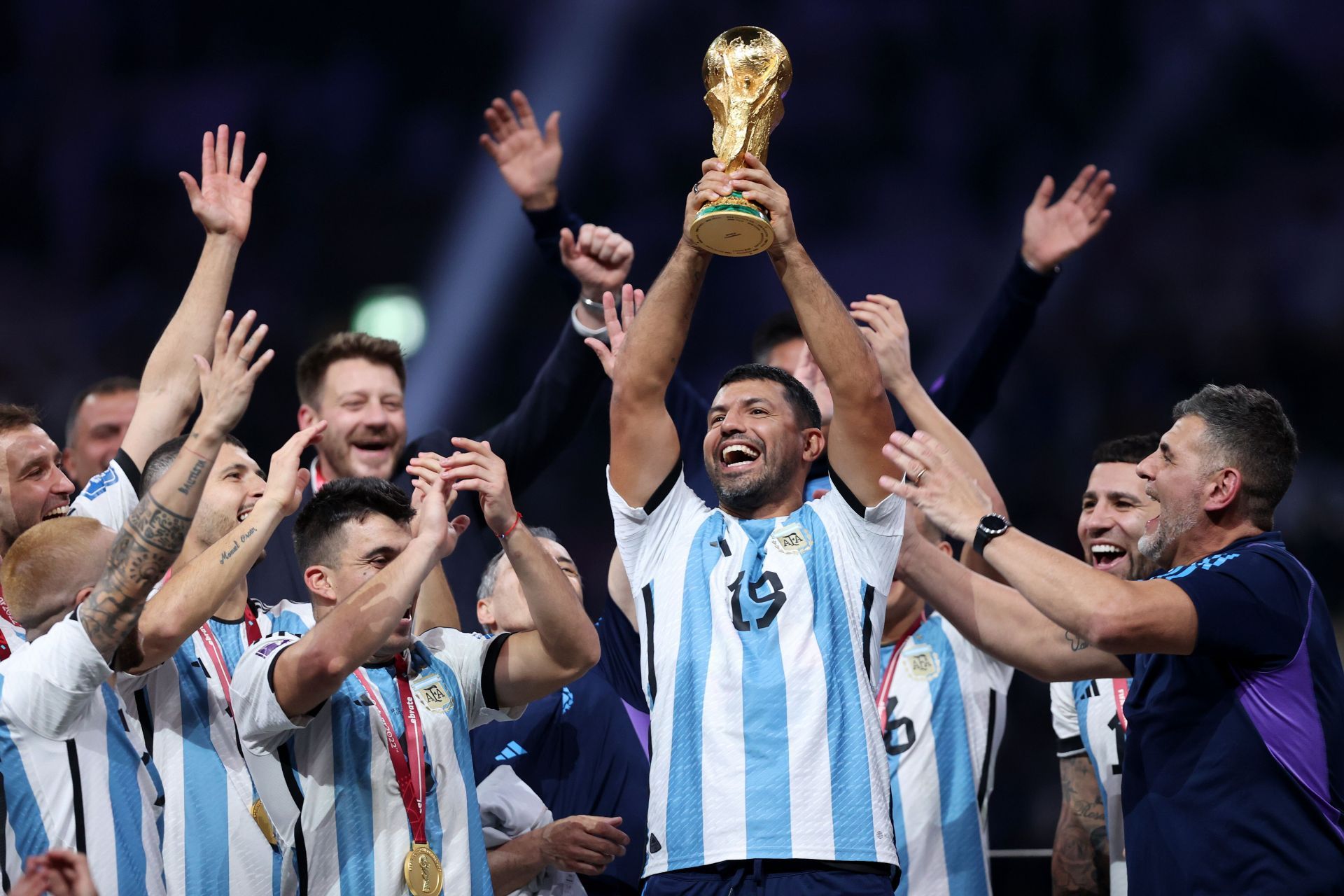 Aguero lifting the World Cup trophy