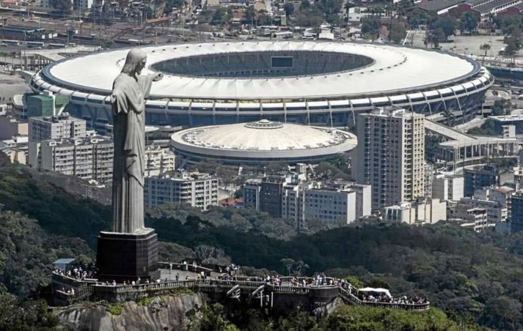 Christ the Redeemer statue overlooks the imposing Maracana Stadium in Rio de Janeiro.