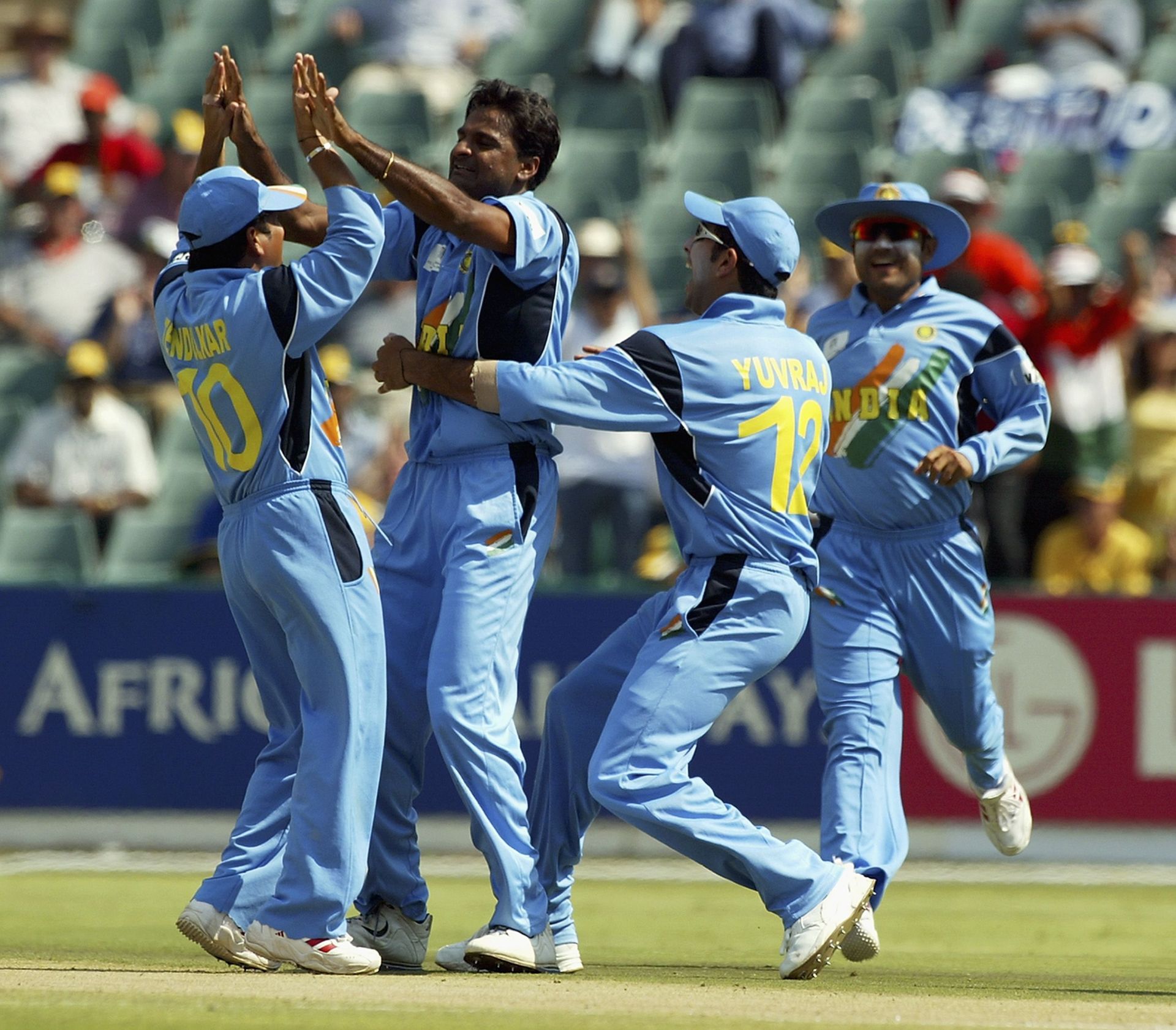 Javagal Srinath of India is congratulated by team-mates after taking a wicket