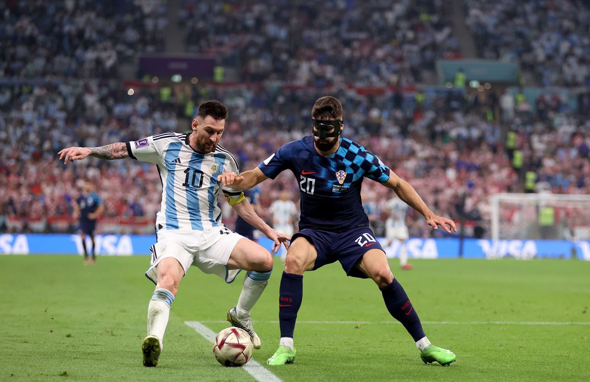 Lionel Messi and Josko Gvardiol engage in a duel for the ball