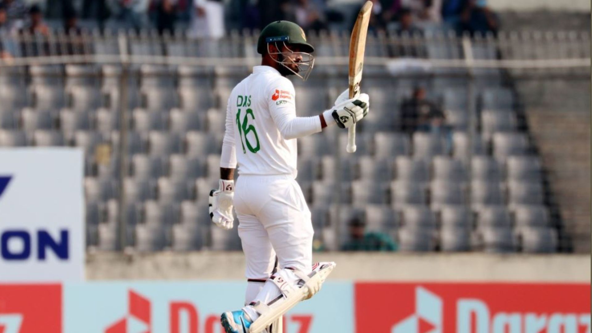 Liton Das raises the bat after scoring a half-century on Day 3 of the 2nd Test against India. 