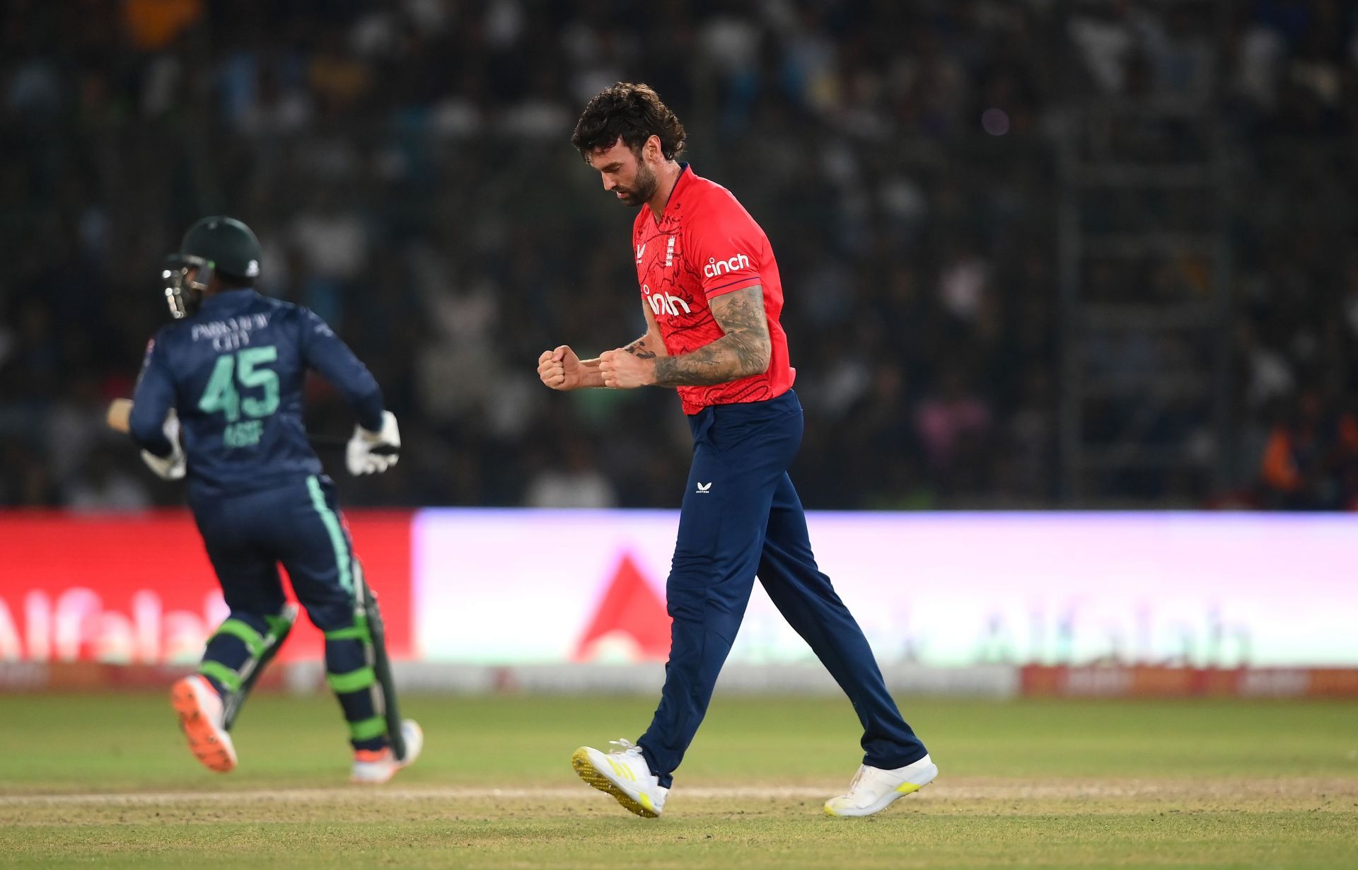 Reece Topley celebrates after picking up a wicket for England
