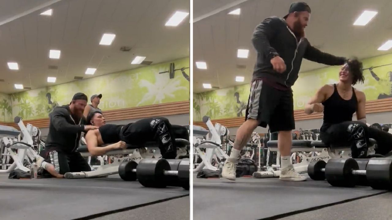 Rhea and Buddy working out together in the gym