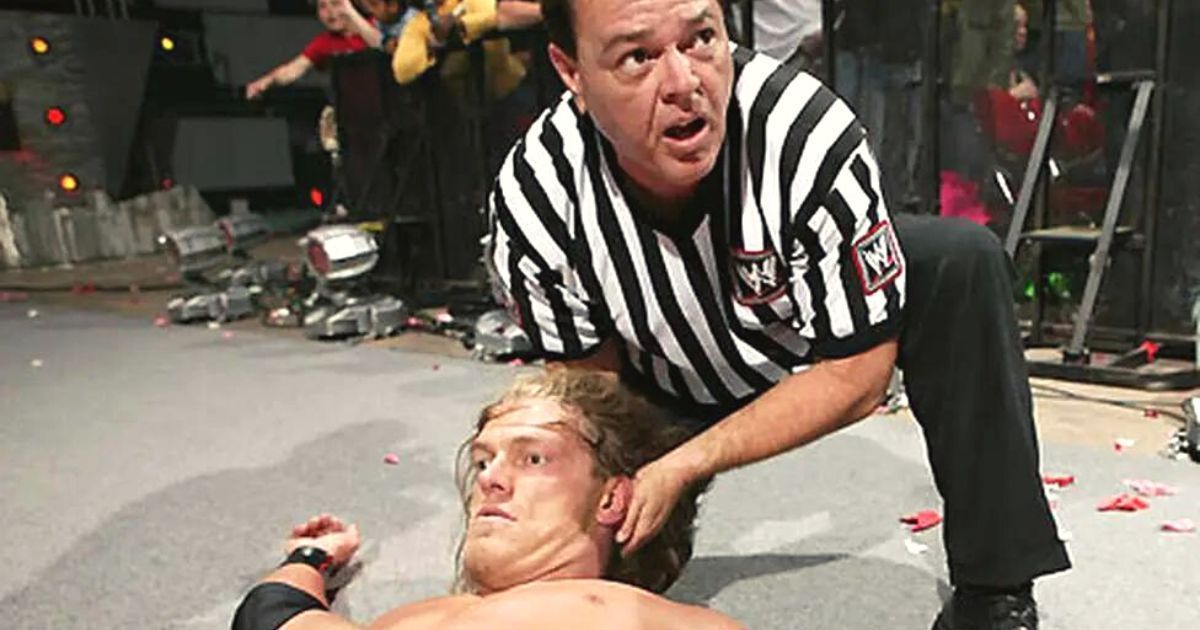 Legendary WWE referee Mickie Henson with Edge after a match.