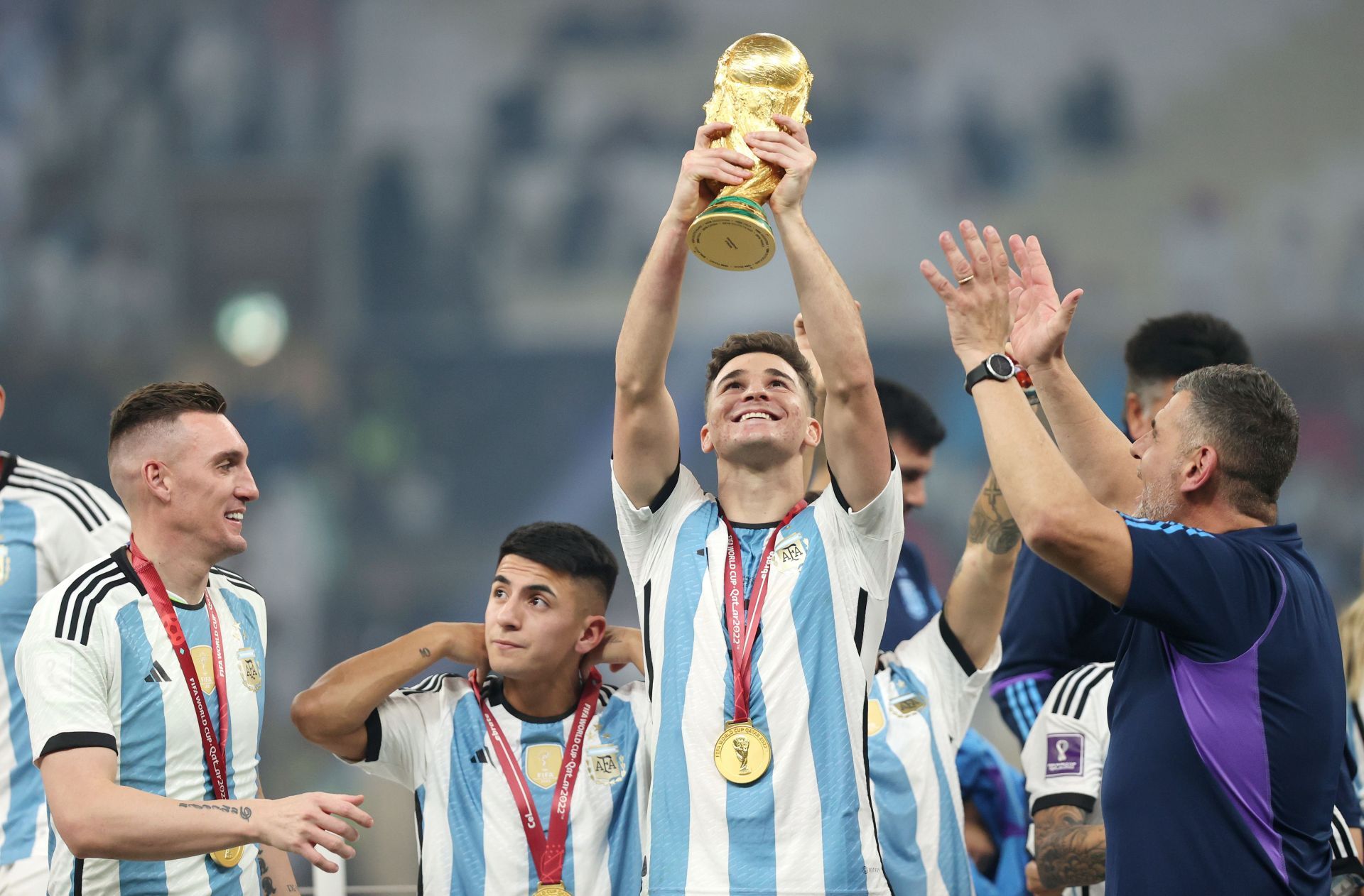 Alvarez lifting the 2022 FIFA World Cup trophy
