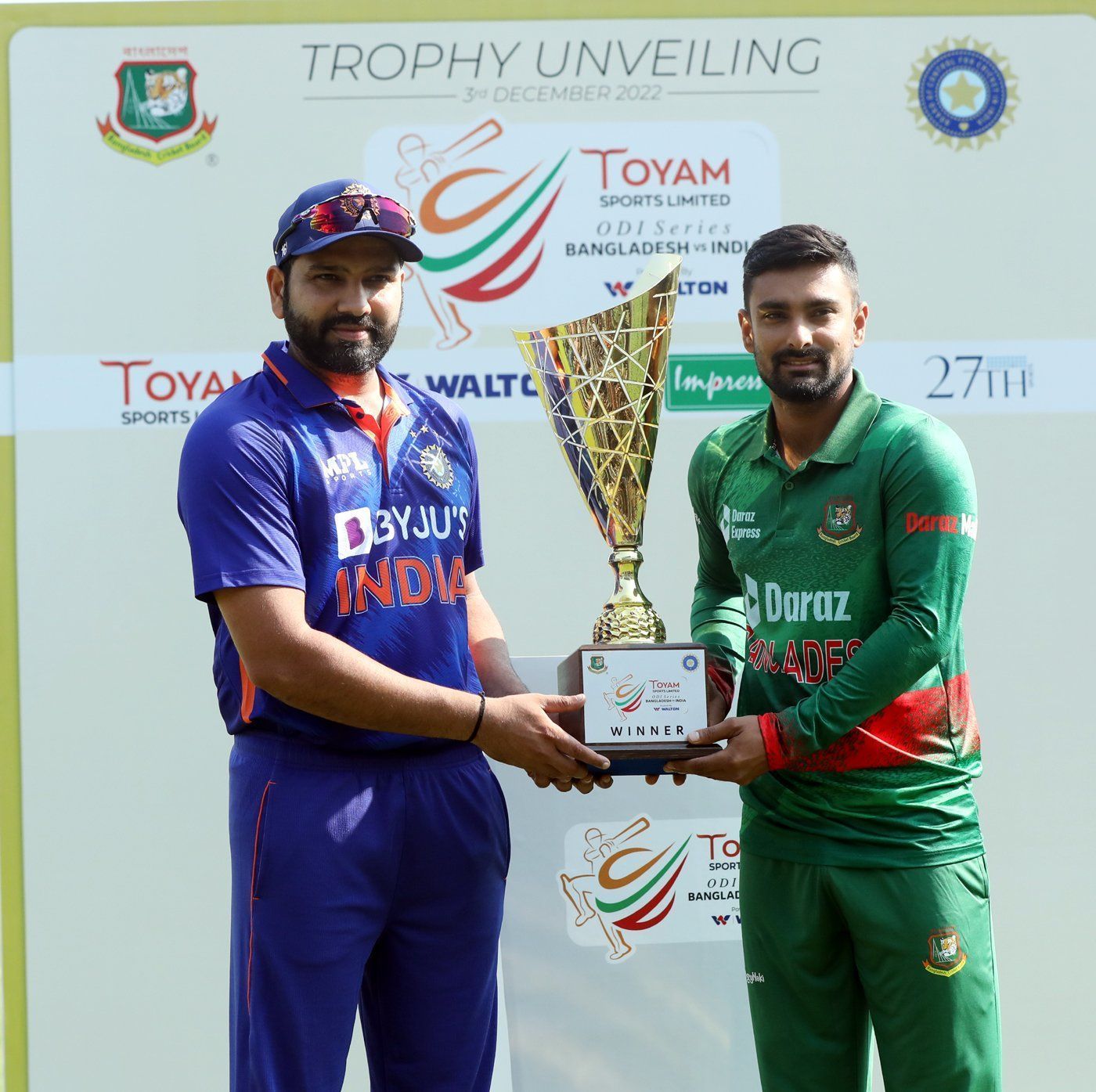 Rohit Sharma and Litton Das pose with a trophy [Pic Credit: BCCI]